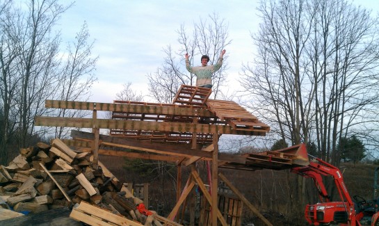 Danila on the roof, attaching pallets